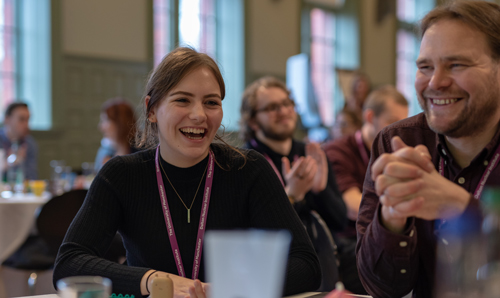 Students laughing at awards ceremony